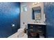 Stylish powder room featuring bold wallpaper, a modern vanity, and sleek fixtures at 2533 N Emerson St, Denver, CO 80205