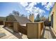 Exterior view of the unit featuring a wooden deck, railings, stairs and exterior views of other units under a blue sky at 2711 Mapleton Ave # 27, Boulder, CO 80304