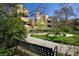 Multi-unit property featuring a bench with beautiful landscaping, lush greenery, and tranquil setting for outdoor enjoyment at 2711 Mapleton Ave # 27, Boulder, CO 80304