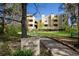 Inviting multi-unit property with lush lawn, mature trees, and prominent signage, offering a serene residential environment at 2711 Mapleton Ave # 27, Boulder, CO 80304