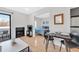 Cozy living room with a fireplace and balcony, seamlessly connecting to the bedroom for a comfortable, integrated living space at 2711 Mapleton Ave # 27, Boulder, CO 80304