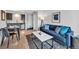 Inviting living room featuring an open layout with a modern sofa, kitchen view, and stylish decor for comfortable living at 2711 Mapleton Ave # 27, Boulder, CO 80304