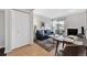 Comfortable living room with a modern sofa, marble coffee table, fireplace, and views to the outside from the balcony at 2711 Mapleton Ave # 27, Boulder, CO 80304