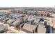 Sweeping aerial view showcases uniform rooftops, highlighting community planning and residential architecture at 5438 Valentia St, Denver, CO 80238