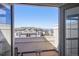 Balcony view with a partial view of the neighborhood, showing other homes on a bright sunny day at 5438 Valentia St, Denver, CO 80238