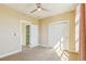 Bedroom featuring carpeted floors, a ceiling fan, and a closet at 5438 Valentia St, Denver, CO 80238