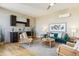 Cozy living room featuring a wet bar, comfortable seating, and stylish decor at 5438 Valentia St, Denver, CO 80238