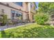 Lawn and patio area with comfortable seating perfect for relaxing and entertaining outside at 11839 E Maplewood Ave, Greenwood Village, CO 80111
