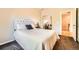 Inviting bedroom with soft lighting and a quilted bedspread with nearby closet at 11839 E Maplewood Ave, Greenwood Village, CO 80111