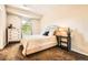 Serene bedroom features neutral tones, a comfy bed, and great natural light at 11839 E Maplewood Ave, Greenwood Village, CO 80111
