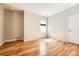 Bright bedroom with hardwood floors, natural light, and neutral paint, creating a serene atmosphere at 11839 E Maplewood Ave, Greenwood Village, CO 80111