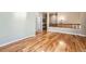 Spacious room featuring beautiful hardwood floors and neutral walls, creating a cozy and inviting atmosphere at 11839 E Maplewood Ave, Greenwood Village, CO 80111