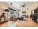 Cozy living room with hardwood floors, comfortable sofas, and a large window for natural light at 11839 E Maplewood Ave, Greenwood Village, CO 80111
