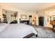 Spacious main bedroom with great light, furniture, and en suite bathroom at 11839 E Maplewood Ave, Greenwood Village, CO 80111