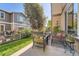 Outdoor patio with comfortable seating area perfect for relaxing and entertaining, on a sunny day at 11839 E Maplewood Ave, Greenwood Village, CO 80111
