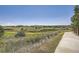 Scenic walking path through the community with beautiful landscaping at 11839 E Maplewood Ave, Greenwood Village, CO 80111