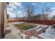 Backyard with grass, patio, and wooden fence at 154 Cisne Cir, Brighton, CO 80601