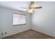 Bright bedroom with ceiling fan and neutral carpeting at 154 Cisne Cir, Brighton, CO 80601