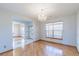 Formal dining room with hardwood floors and chandelier at 154 Cisne Cir, Brighton, CO 80601