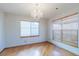 Formal dining room with hardwood floors and chandelier at 154 Cisne Cir, Brighton, CO 80601