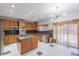 Spacious kitchen featuring granite countertops and island at 154 Cisne Cir, Brighton, CO 80601