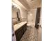 Clean bathroom with updated vanity and patterned flooring at 234 S Brentwood St # 105, Lakewood, CO 80226