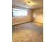 Neutral bedroom featuring a large window and carpeted floors at 234 S Brentwood St # 105, Lakewood, CO 80226