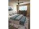 Comfortable bedroom with stylish decor, a ceiling fan, and a large window at 234 S Brentwood St # 105, Lakewood, CO 80226