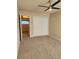 Well-lit bedroom with neutral carpeting and double-door closet at 234 S Brentwood St # 105, Lakewood, CO 80226