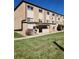 Building exterior with ample parking and green space at 234 S Brentwood St # 105, Lakewood, CO 80226