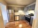 Modern kitchen featuring stainless steel appliances and wood flooring at 234 S Brentwood St # 105, Lakewood, CO 80226