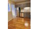 Bright kitchen boasts stainless steel appliances and wood floors at 234 S Brentwood St # 105, Lakewood, CO 80226