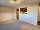 Spacious living room with neutral carpeting and a kitchen pass-through at 234 S Brentwood St # 105, Lakewood, CO 80226