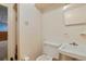 Small bathroom with essential amenities, including a toilet and sink at 1803 Graves Ct, Northglenn, CO 80233