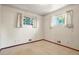 Bright bedroom with carpeted floors, natural light, and closet at 1803 Graves Ct, Northglenn, CO 80233
