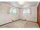 Light-filled bedroom with carpeted floors and good natural light at 1803 Graves Ct, Northglenn, CO 80233
