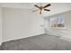 Spacious bedroom with ceiling fan and carpeting at 8937 Apache Plume Dr, Parker, CO 80134