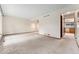 Large basement with neutral carpeting and access to the kitchen at 10208 E Jewell Ave # 18, Aurora, CO 80247