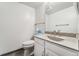 Clean half bathroom with updated vanity, stone countertop and modern fixtures at 10208 E Jewell Ave # 18, Aurora, CO 80247