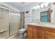 This bathroom features a shower stall with a sliding glass door and wooden vanity at 10208 E Jewell Ave # 18, Aurora, CO 80247