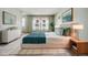 Light-filled bedroom with calming colors, plush carpeting, and stylish furniture at 10208 E Jewell Ave # 18, Aurora, CO 80247