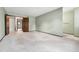 Large bedroom with pale green walls features neutral carpet and access to other rooms at 10208 E Jewell Ave # 18, Aurora, CO 80247