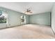 Bright bedroom with large windows, soft carpet, and ceiling fan at 10208 E Jewell Ave # 18, Aurora, CO 80247