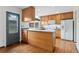 Cozy kitchen features wooden cabinets, stone countertops, and stainless steel appliances at 10208 E Jewell Ave # 18, Aurora, CO 80247