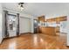Open-concept kitchen with wooden cabinets, stainless steel appliances and hardwood floors at 10208 E Jewell Ave # 18, Aurora, CO 80247