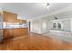 Bright and airy living room and kitchen combo boasts hardwood floors and ample natural light at 10208 E Jewell Ave # 18, Aurora, CO 80247