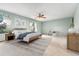 Spacious main bedroom featuring carpet, a ceiling fan, and light green walls at 10208 E Jewell Ave # 18, Aurora, CO 80247