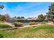 Well maintained community tennis courts surrounded by lush greenery at 10208 E Jewell Ave # 18, Aurora, CO 80247