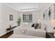 Serene bedroom with natural light, a comfortable bed, and a view of the balcony at 4200 W 17Th Ave # 211, Denver, CO 80204