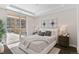 Cozy bedroom with a large window, a view of the outdoor balcony, and stylish decor at 4200 W 17Th Ave # 211, Denver, CO 80204